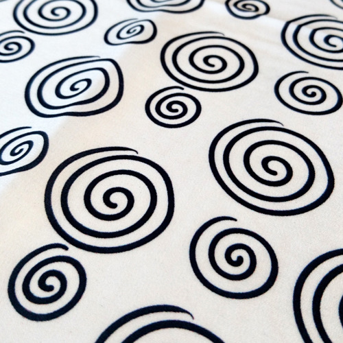 Black spiral pattern indelibly printed at white background, bold and clear, in high contrast design.