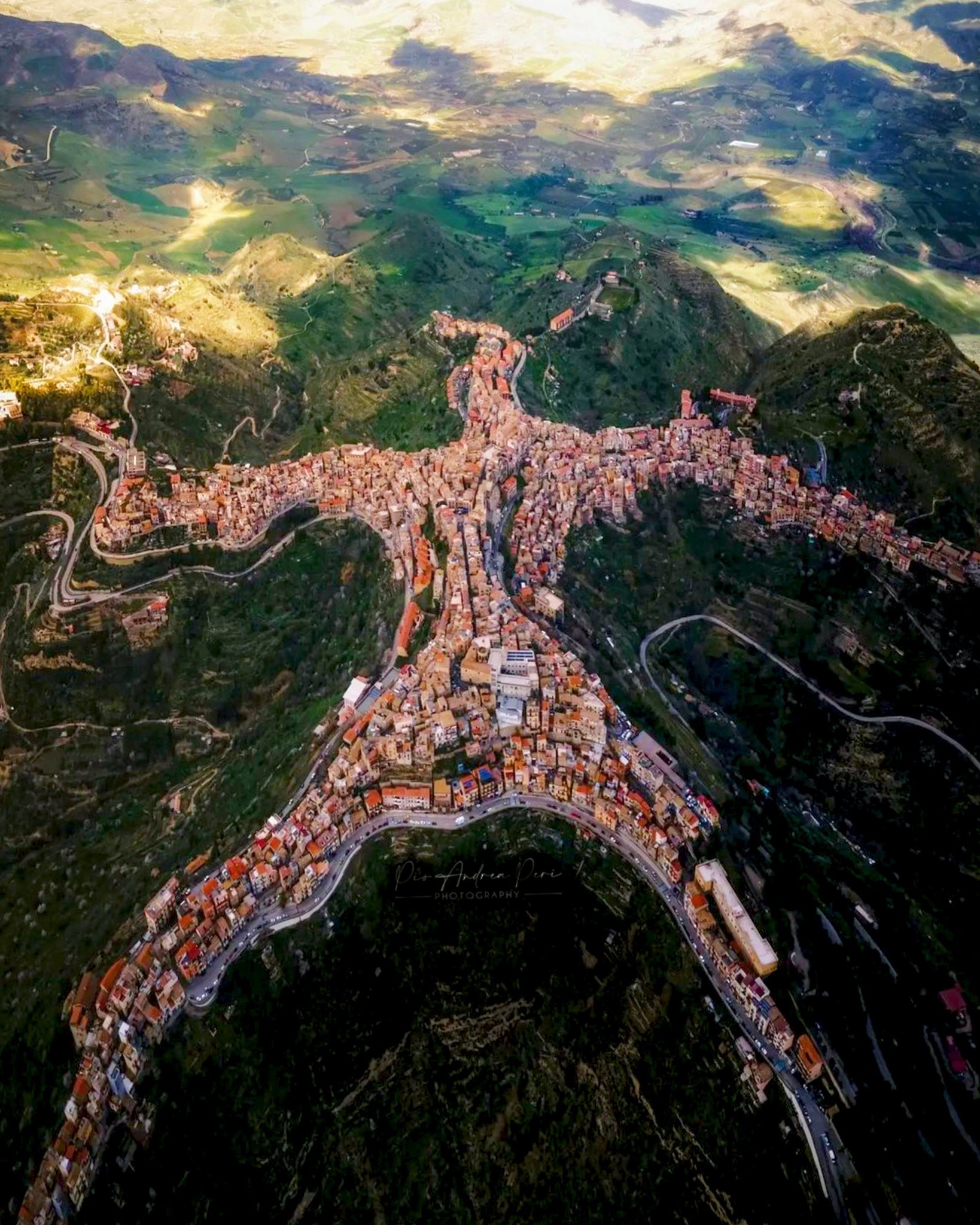 dailyoverview:Centuripe is a town of about 5,400 people on the island of Sicily, in southern Italy. It is located in hill country, between the Dittaino and Salso rivers, at roughly 2,400 feet (730 m) above sea level. When viewed from this aerial angle,