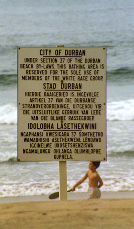 A sign outlining the apartheid rules on a beach in Durban, South Africa. 1989. The sign is in Englis