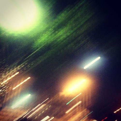 Full moon, sodium lights, trees, blur.