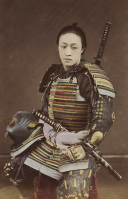thekimonogallery:  Hand-colored photo-portrait of a man in samurai armor.  Circa 1876, Japan.  Photographer Kozaburo Tamamura. 