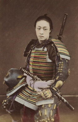 thekimonogallery:  Hand-colored photo-portrait of a man in samurai armor.  Circa 1876, Japan.  Photographer Kozaburo Tamamura.   