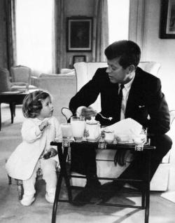 essentialisinvisible:  John F. Kennedy having a tea party with his daughter, Caroline. 