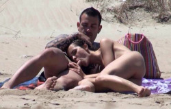 favthgs:  Looks like she has spied the camera that is spying on them. But she just keeps sucking that cock on the public beach.  More pictures of sex and nudity on the beach in this free gallery.