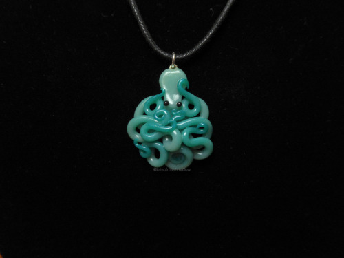 Ombre from translucent ocean blue to shimmery turquoise. Subtle :)www.etsy.com/listing/26978