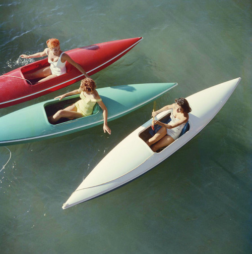 artbun:swinginglamour:Young women canoeing on the Nevada side of Lake Tahoe, photographed by Slim Aa