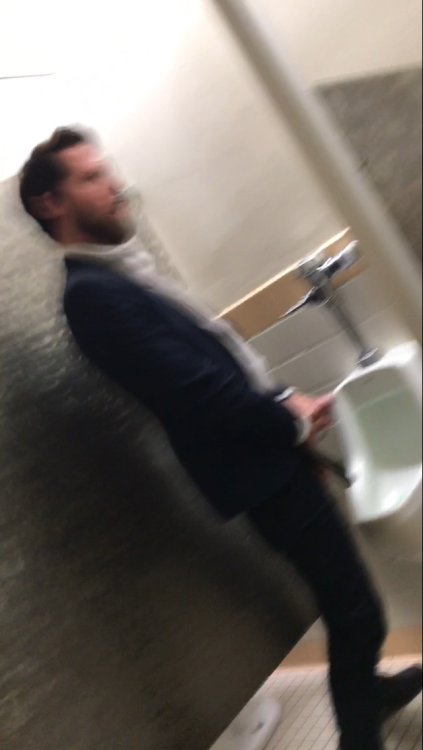 hobartgloryhunter:  gloryholecam:Don’t know why this didn’t post the 1st time. Super hot, bearded, suited, hairy, tatted and lean guy. Jerking it at the urinals. Said no to me blowing at first but as soon as he weakened I jumped down there and he