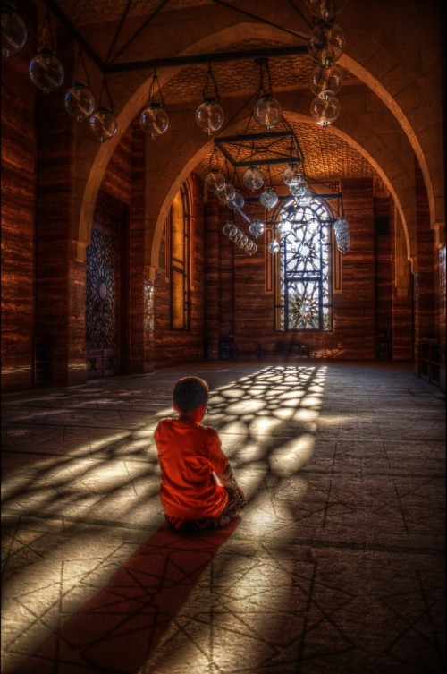 Boy Prays at Al-Fateh Grand Mosque in Manama, Bahrain