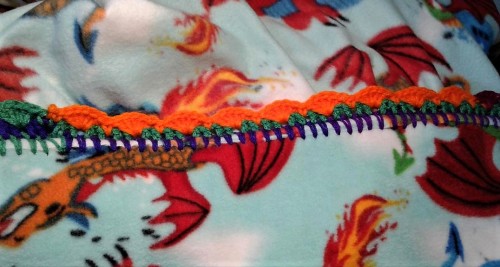 johnthestitcher:Another fleece blanket with a variegated rainbow yarn in primary colors. I bought a 