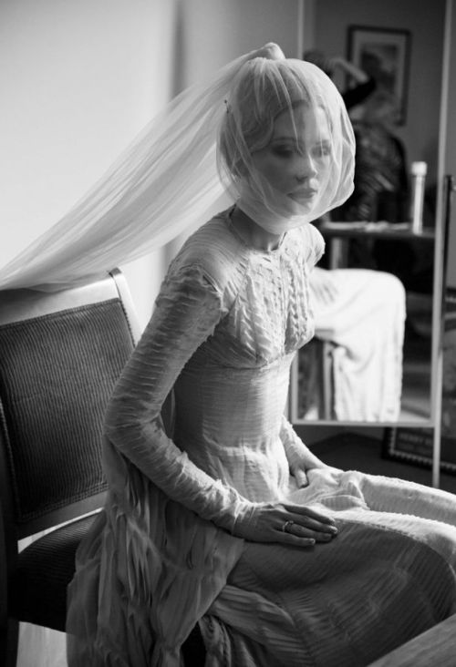 Katie Shillinforg in a custom Gareth Pugh dress, hours before her wedding Photographed by Amy Gwatki