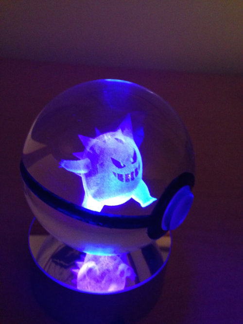 sixpenceee:These crystal Poke Balls hold a 3D etched pokemon inside them that glows with the LED lig