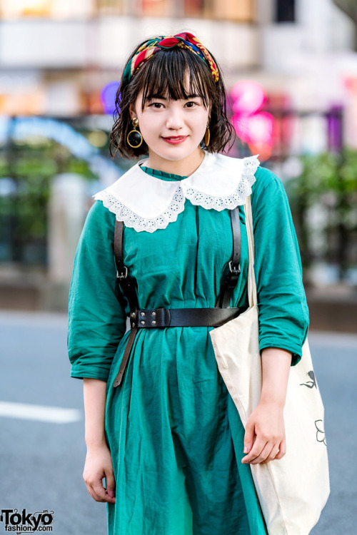 17-year-old Japanese student Moka on the street in Harajuku wearing a leather harness over vintage d