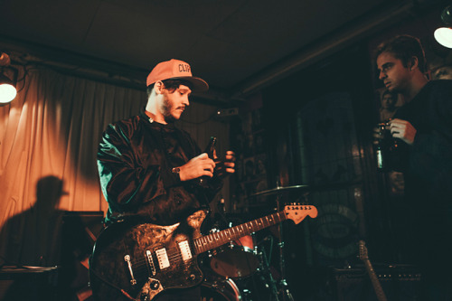 jennifersando:  Nathan Williams of WAVVES is handed a beer before we saw tidal waves of people crashing onto their set. (I was lucky enough to be trapped in there the first time.) Ed Castle, Adelaide.  