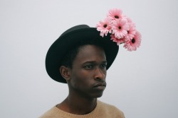 dynamicafrica:  In Conversation with Brandon Stanciell - The Man Who Loves Flowers.One of the first-ever photographs I came across involving a black man tenderly clutching flowers and gazing into  the lens of the camera was a self-portrait by Cameroonian