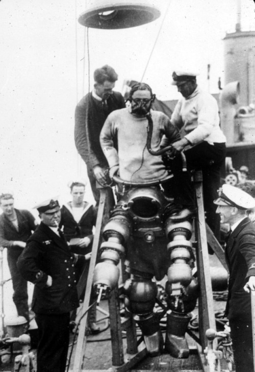 Divers prepare to explore the wreck of the Lusitania, 1935. The Lusitania, a similar design to the m