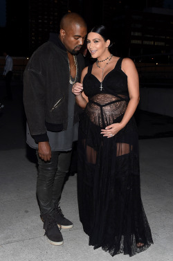 celebritiesofcolor:  Kanye West and Kim Kardashian attend the Givenchy fashion show during Spring 2016 New York Fashion Week at Pier 26 at Hudson River Park on September 11, 2015 in New York City.