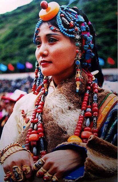 thehoruseye:“Beautiful Tibetan girl at Litang Horse Festival wears fur robes and her family’s treasu