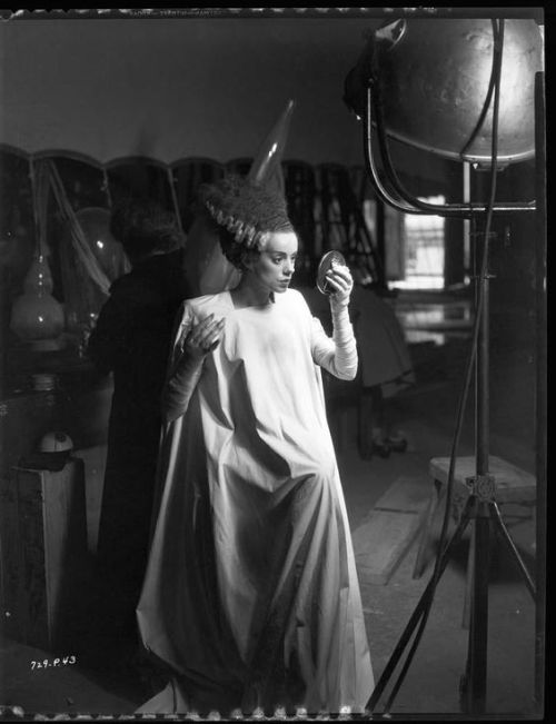 oldhollywoodfilms:Elsa Lanchester checks her makeup on the set of The Bride of Frankenstein (1935).