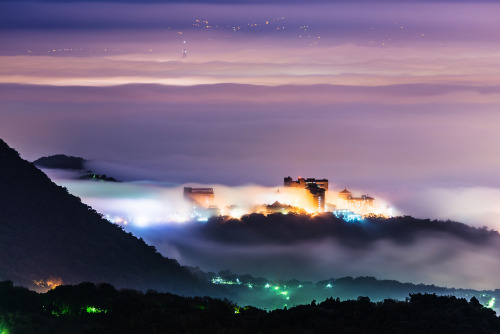 asylum-art: ”Cloud of mist and sparkling lights, Taipei appears as a supernatural landscape” by  王韋証