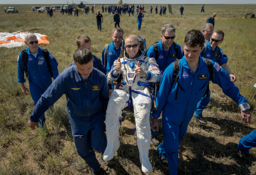 NASA astronaut Tim Kopra is carried to the medical tent shortly after landing aboard Soyuz TMA-19M, 