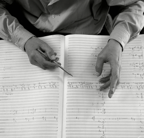barcarole:Hands of German composer Carl Orff with his score for Antigonae - a musical setting after 