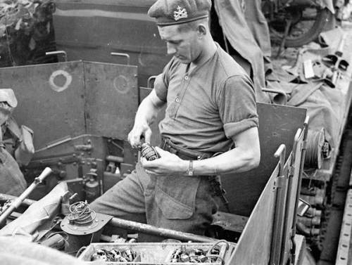 Lance-Corporal George Gagnon, 14th Field Regiment, Royal Canadian Artillery (RCA), fusing hand grena