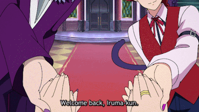 This is a GIF with 3 characters from the anime Welcome to Demon School Iruma Kun: Iruma, Sullivan, and Opera. Iruma is a fair skinned human boy with blue hair and blue eyes. He opens his mouth in a smile with blush coming on to his cheeks. Sullivan is a fair skinned demon, he has two yellow horns on the side of his head and pointed ears. He wears glasses, has a white mustache, and is making a happy expression with his eyes. He is wearing a purple jacket with fur on the collar and a long skull at the neckline. He is wearing deep purple pants. He is standing on the left side of the gif. Opera is a fair skinned cat demon with red eyes. They have pointed demon ears. They have a red bobcut with red cat ears on top. They are wearing a white collared shirt with a red vest on top and a red bow at the neckline. They have two gold rings on their middle finger. They are wearing black tracksuit pants. Their black tail is curled from right to left. They are standing on the right side of the gif with a happy expression. Sullivan and Opera are saying Welcome back, Iruma-kun. All three of them are standing in their home, The background for Iruma is the top of the entrance of the home, with purple walls and three purple windows going top to bottom on each side, the top two containing demon horns. The camera then cuts to Sullivan and Opera, with their background being the inside of their home. The floor is patterned with yellow and brown diamonds, with a red carpet in the middle leading to silver steps that show double black doors. There are green steps that lead up to the second floor, with fencing on the sides of the steps and the floor. There are blue and green windows on the walls. There is a pink banner in the middle with six visible characters going from left to right with rainbow colors but backwards, starting at purple and ending at yellow. The banner has purple and yellow roses alternating around the border. There's a yellow streamer on top of the banner and a blue streamer on the bottom of the banner. There is a gold chandelier on the celing.