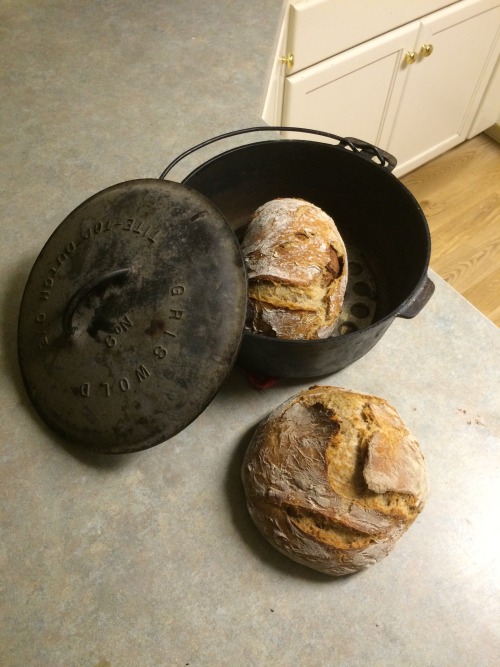 Putting my new (to me) Dutch oven to use. Droppin a cinnamon swirl and a whole wheat loaf on the hat