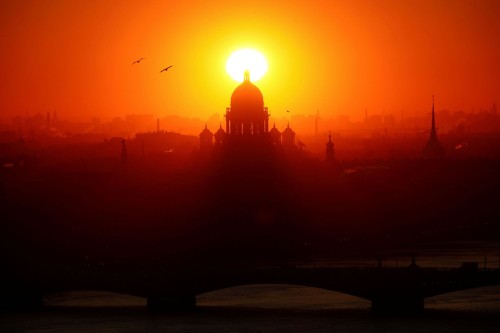 The sun sets behind Saint Isaac’s Cathedral in Saint Petersburg, Russia, on December 8, 2020.Anton V