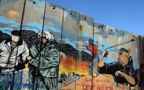 Mural on a section of the Israeli apartheid wall in Palestine