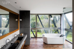 interiordesignmagazine:  In the cool, breezy highlands an hour and a half’s drive inland from Rio de Janeiro, in the town of Itaipava, this house by Miguel Pinto Guimarães is meant to be invisible thanks to its grass-covered roof. Shown: The tub in