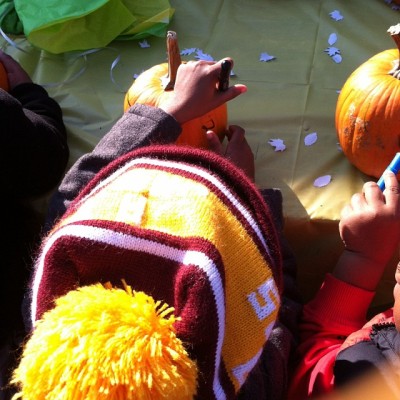 Decorating her pumpkin