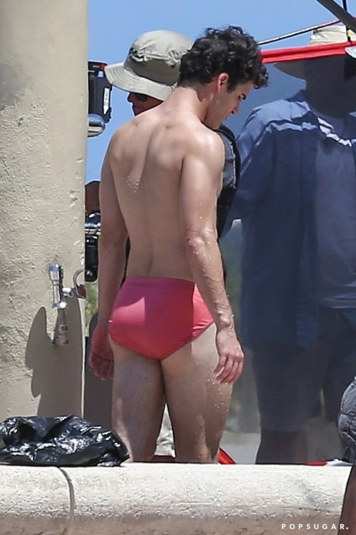 celebritybodybuge:  Darren Criss Part 1 Darren Criss in a red speedo as Andrew Cunanan on the set of The Assassination of Gianni Versace; American Crime Story.