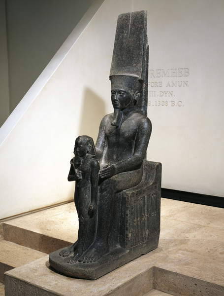 Horemheb before Amun-ReDiorite statue depicts the pharaoh Horemheb before the god Amun-Re. New Kingd