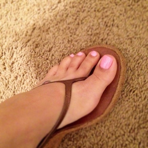 Sexy tan thong sandals with a wedge heel.