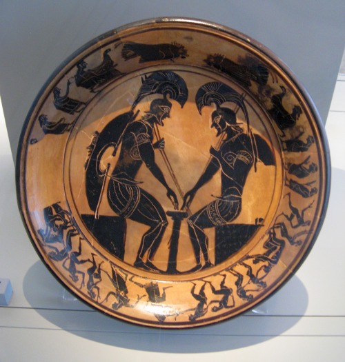 Two warriors (Achilles and Ajax?) playing a board game.  Attic black-figure plate, artist unknown; c