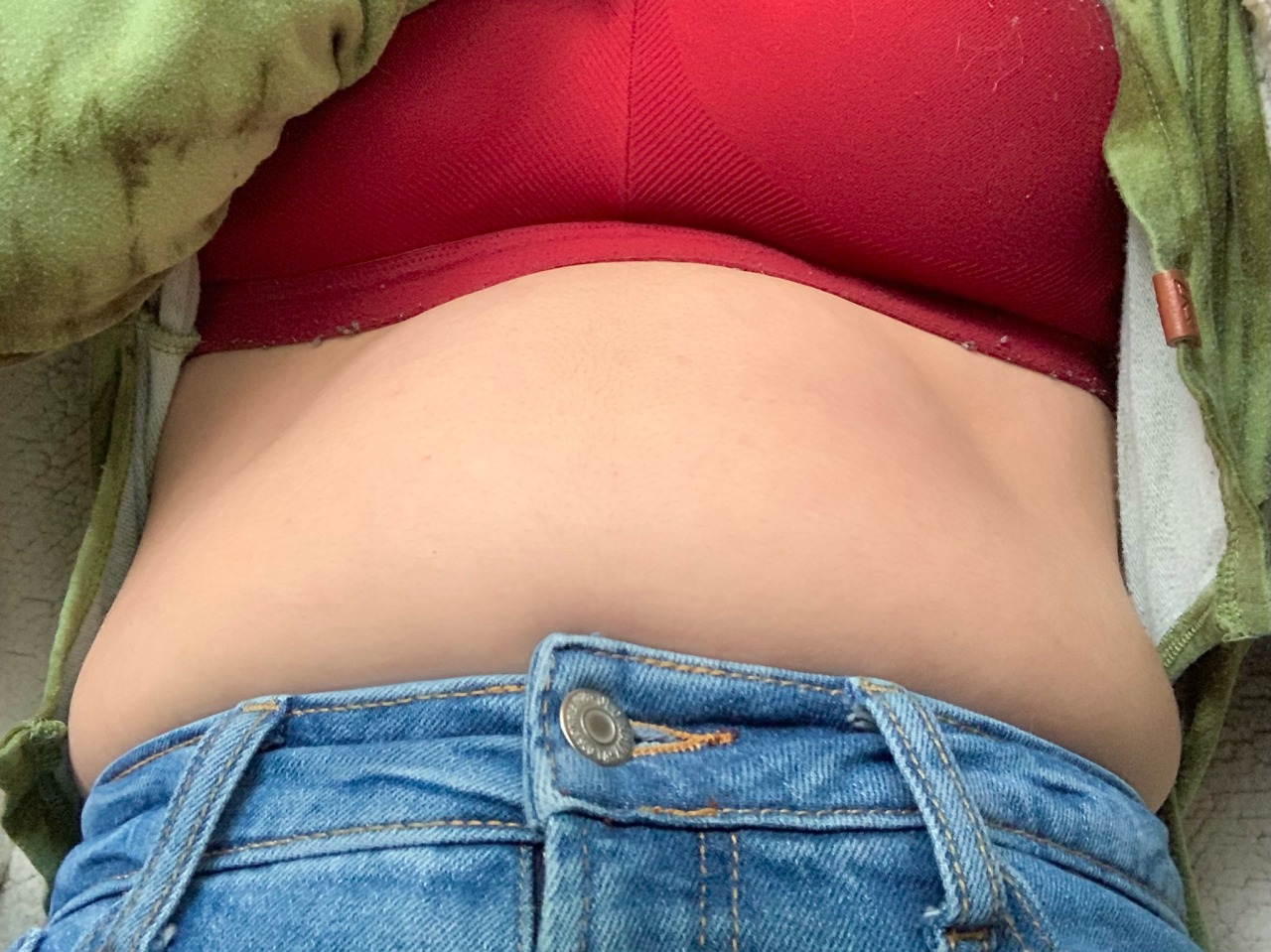 :These are brand new jeans… How is my belly already bulging out of them??? 