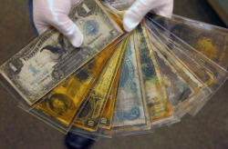 orny1312:Algunos billetes de diferentes países que fueron hallados en los restos del Titanic