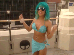 fuckyeslilkim:  Lil’ Kim models a blue suede bikini on MTV’s ‘House Of Style’ , 2000.
