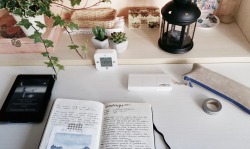 josephine-habits:  that’s my work space, you can find: a lot of plants, some hand made boxes, succulent shaped candles, my kindle paperwhite, an ikea alarm clock, winsor &amp; newton watercolors, my moleskine and my pencil case. that’s what happens