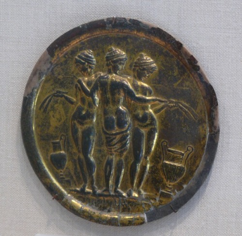 Ancient Roman gilded bronze mirror depicting the three Graces.  Artist unknown; mid-2nd cent. CE.  N