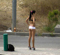 carelessnaked:  Standing on the road in a micro skirt and showing most of her ass