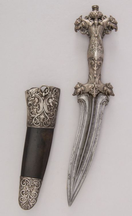 art-of-swords:  Siha Kaetta Dagger with Sheath Dated: circa 1700 Culture: Sri Lankan Medium: silver, shark skin Measurements: H. with sheath 12 5/8 in. (32.1 cm); H. without sheath 12 1/4 in. (31.1 cm); H. of blade 7 in. (17.8 cm); W. 2 5/8 in.