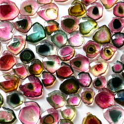 cheap-bliss:  mineralists:Slices of Watermelon Tourmaline  Wow this is a dreaaaam