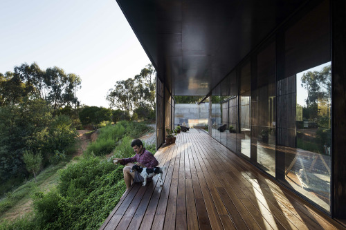 cjwho:  SawMill House, Australia by Archier Studio |via  From the architect: The Sawmill House uses large reclaimed one tonne blocks of reclaimed concrete which anchor it into the landscape and a dynamic active building envelope to regulate the internal