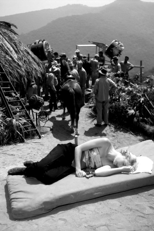 Grace Kelly takes a nap in the sun on the set of Mogambo, 1953