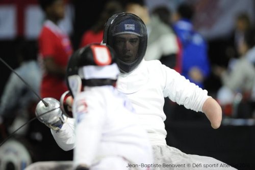 [ID: three photos of a wheelchair epee fencer lunging at his opponent.]Fencing at Montreal 2018!