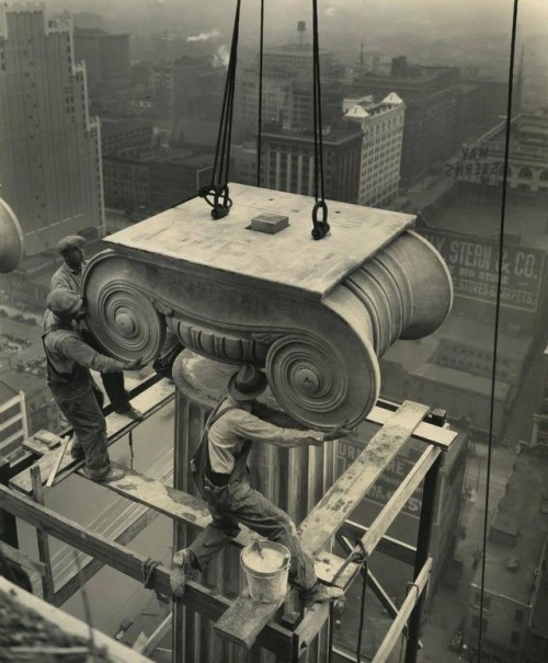 Laborers installing a Greek Ionic column at the Civil Courts Building in St. Louis, Missouri in 1928