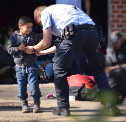 emt-monster:  Police officers play with Syrian children at the Danish border  This made my night