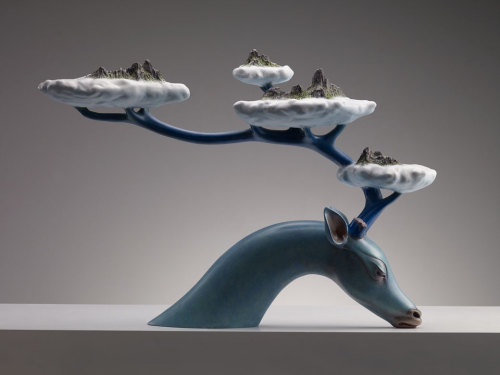 escapekit: Dreams An ongoing series by Chinese sculptor Wang Ruilin who creates surreal animals Sculptures. The animals backs, and sometimes their antlers, function as arcs that carry monumental elements of nature like lakes and mountain cliffs. 
